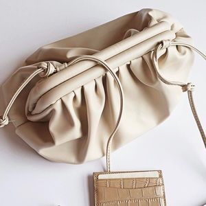 BRAND NEW, never used cream pouch with strap